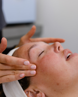 Dermal clinician assessing skin dryness during consultation in Geelong clinic