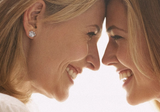 Mother receiving skin treatment gift voucher in Geelong clinic